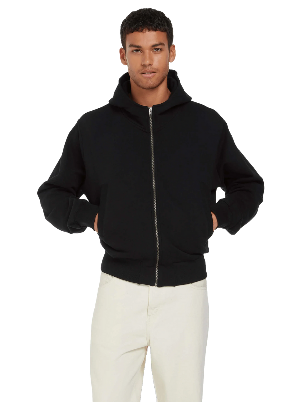 Man wearing the organic bomber jacket hoodie in Black, zipped, hands in pockets