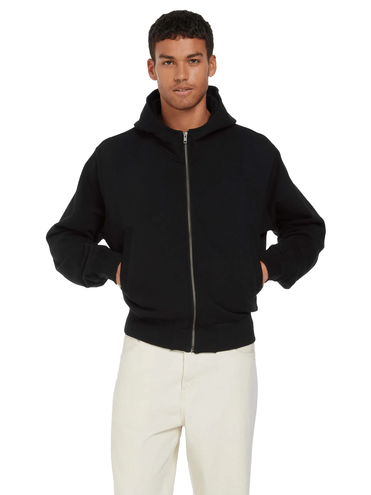 Man wearing the organic bomber jacket hoodie in Black, zipped, hands in pockets