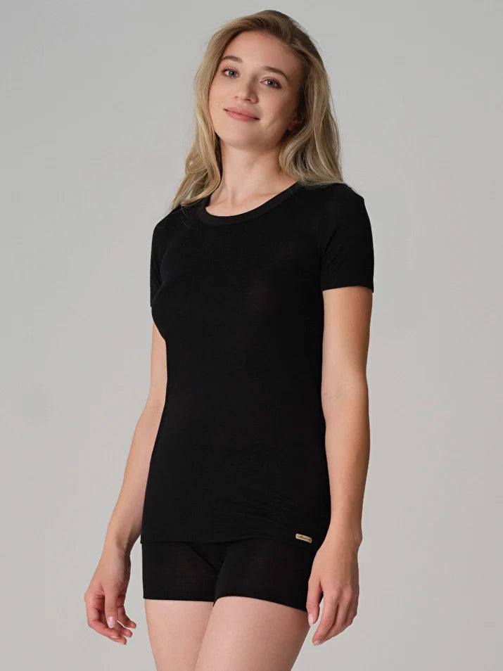 Women's merino wool and silk thermal t-shirt in Black, worn by a model, front view