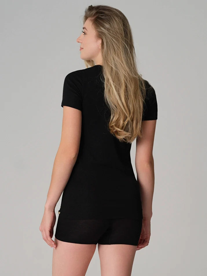 Women's merino wool and silk thermal t-shirt in Black, worn by a model, back view