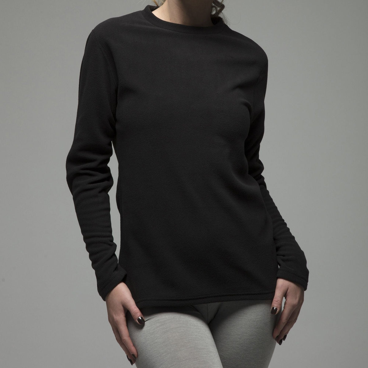 Women's fleece-lined thermal long sleeve top in Black, close-up worn by a model, three-quarter view