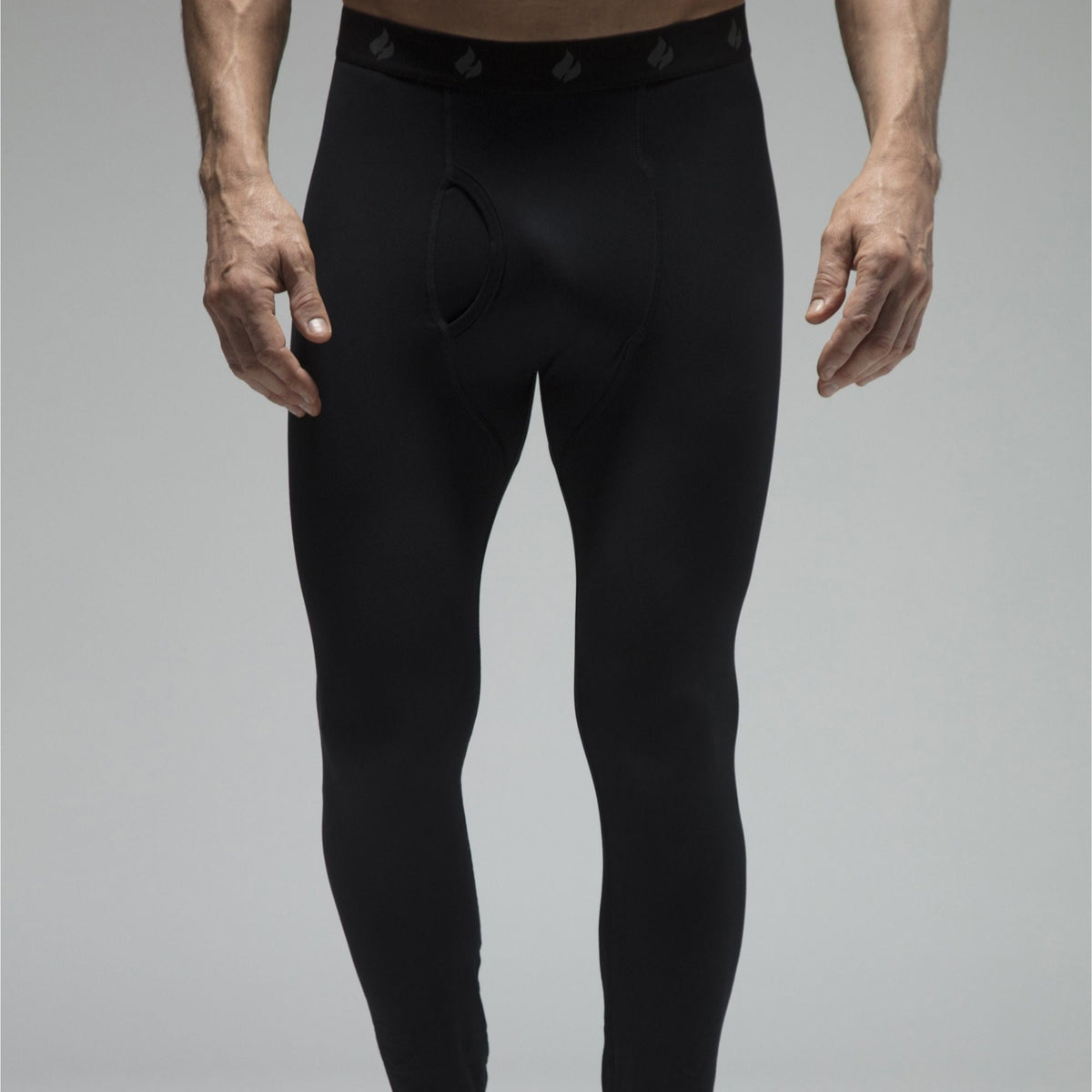 Men's fleece-lined thermal long johns in Black, close-up front view showing the waistband