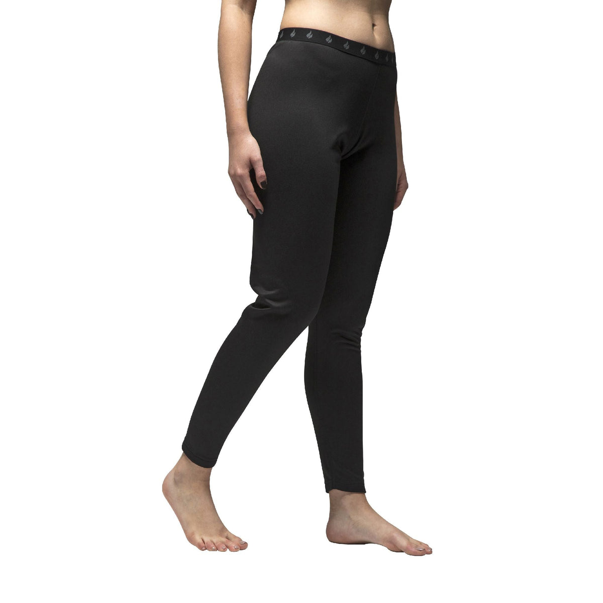 Women's fleece-lined thermal long johns in Black (X-Warm - Lite), worn by a model, three-quarter view