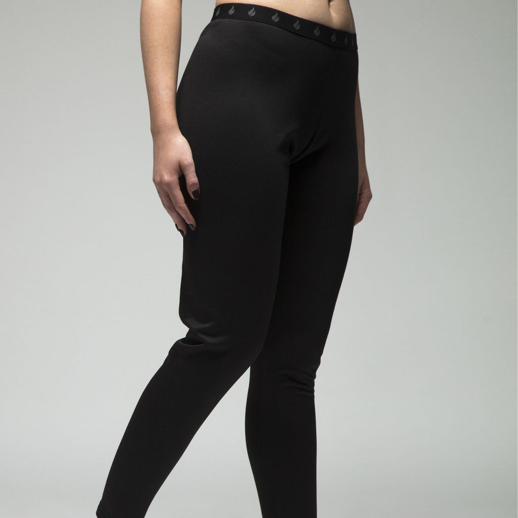 Women's fleece-lined thermal long johns in Black, close-up worn by a model, three-quarter view
