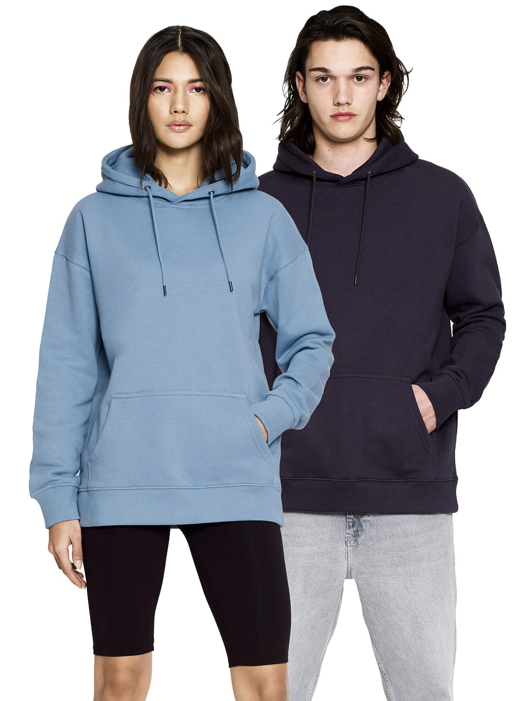 Woman in Blue Dusk and man in a dark navy shade wearing the organic extra heavy dropped shoulder hoodie, front view