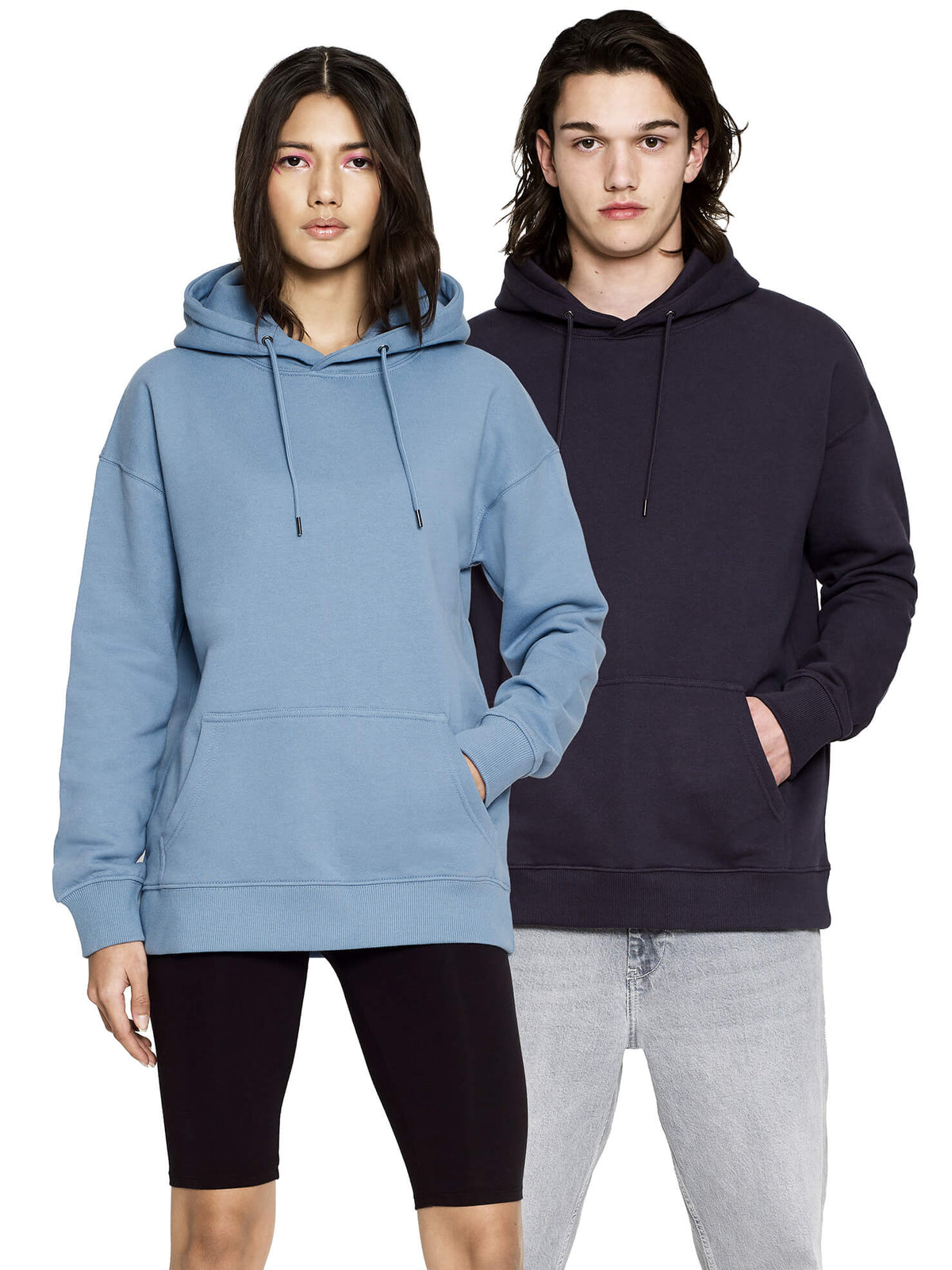 Woman in Blue Dusk and man in a dark navy shade wearing the organic extra heavy dropped shoulder hoodie, front view
