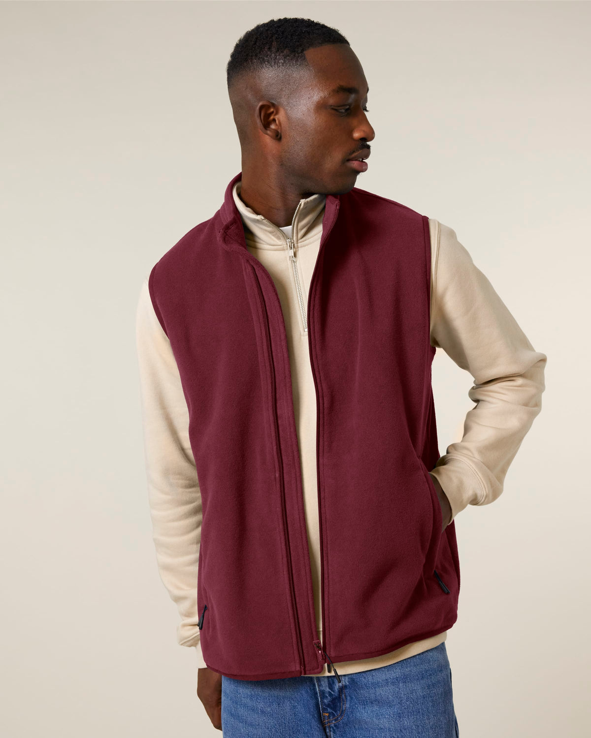 Model wearing the men's recycled fleece bodywarmer in Burgundy, three-quarter front view