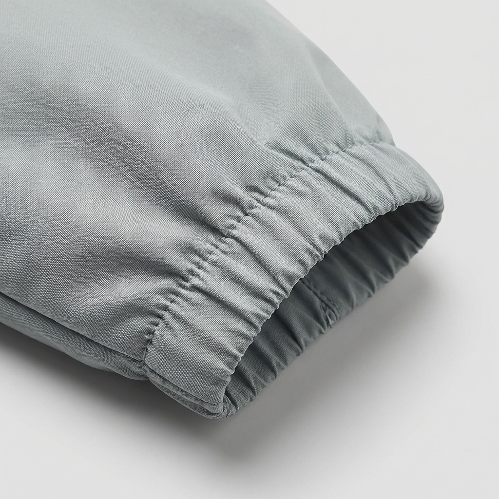 Close-up of the elasticated cuff on the lightweight packable windbreaker jacket in Light Grey